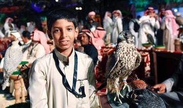 Young Saudi falconer woos visitors at Riyadh exhibition