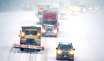 Heavy snow kills three, snarls travel in US Southeast