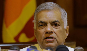 Sri Lanka reinstates ousted prime minister