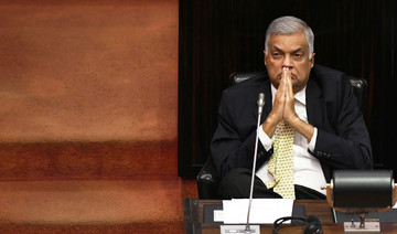 Reinstated Sri Lanka PM promises ‘new era’