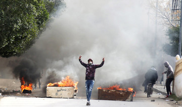 Tunisians clash with police after journalist sets himself ablaze