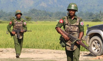 Myanmar says police attacked as western fighting displaces thousands