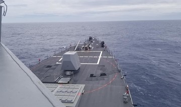US navy ship sails in disputed South China Sea amid trade talks with Beijing