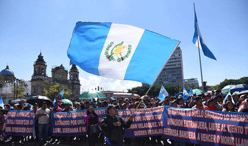 Guatemalans march over president’s bid to close UN anti-graft unit
