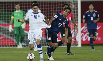 Much-changed Japan beat Uzbekistan to top Group F