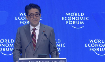 Japan PM Shinzo Abe uses Davos address to put trade, climate change at center of G20 agenda