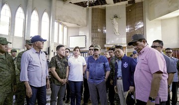 Abu Sayyaf commander among suspects in Philippine church attack; Duterte visits blast site