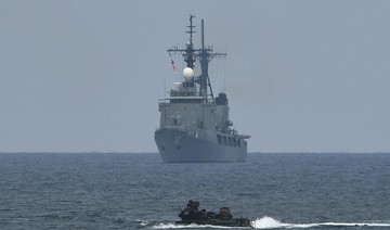US destroyers sail in disputed South China Sea amid trade tensions