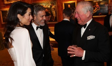 Amal Clooney looks regal at Buckingham Palace party