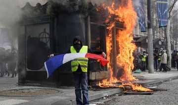 Paris stores looted, bank torched in new 'yellow vest' violence