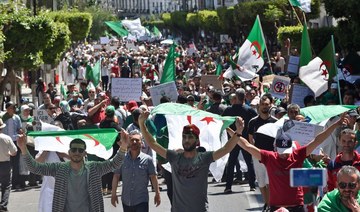 Tens of thousands march to demand change in Algeria