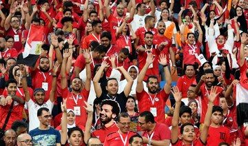 Egyptians light up stadium in tribute to fallen fans
