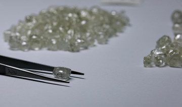 De Beers curbs diamond supply as earnings drop