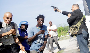 Haiti senator opens fire outside parliament, wounds photographer