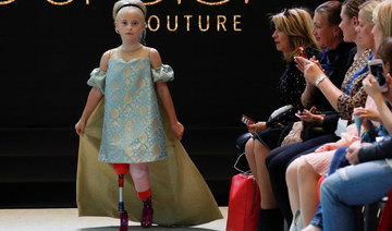 Double amputee girl debuts on Paris fashion catwalk