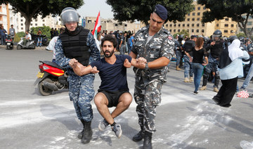 Lebanese police drag protesters, remove roadblocks in Beirut