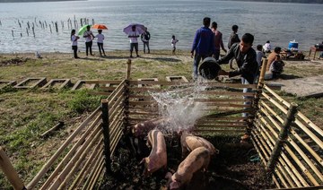 Indonesia’s halal tourism bid faces pig pushback