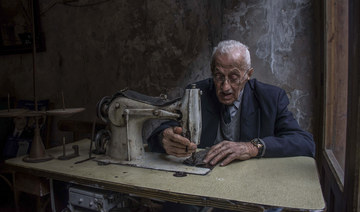 Poignant picture of Lebanese tailor wins prestigious photography award