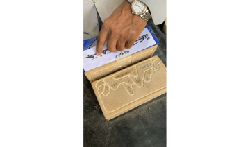 Saudi sculptor carves historic foundation stone