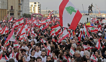 Lebanese protesters, embattled leaders hold separate national day celebrations