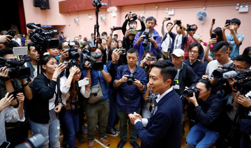 Hong Kong leader vows to ‘listen humbly’ after shock poll result