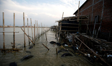 Indonesians pay high price to shield homes from rising sea levels