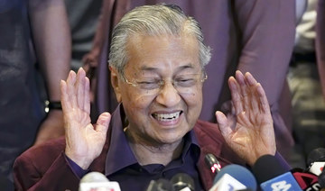 Mahathir to form unity government, sorry for quitting in haste