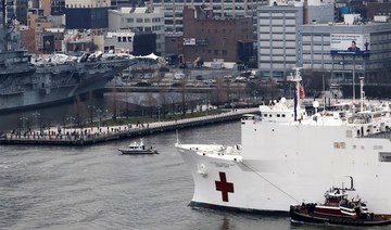New York cheers arrival of hospital ship as coronavirus cases soar