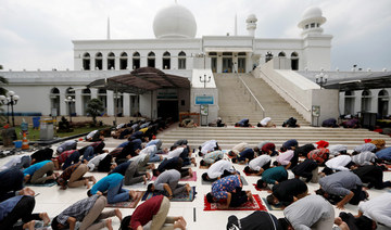 Jakarta mosques reopen as city eases virus curbs