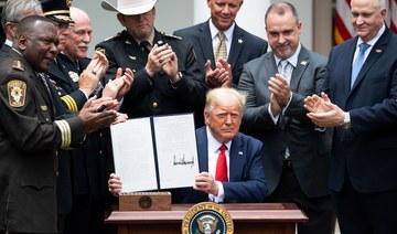 Trump signs order on police reform after weeks of protests about racial injustice