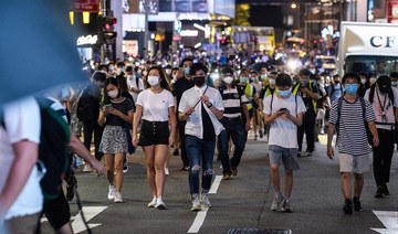 Hong Kongers march in silent protest against national security laws