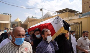 Iraqis mourn expert on armed groups killed by unknown gunmen