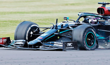 Hamilton wins seventh British Grand Prix on three wheels
