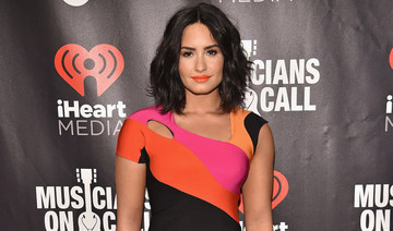 Demi Lovato steps out in Jordanian-Romanian designer after engagement