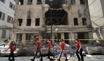 Abandoned by state after explosion, Lebanese help each other