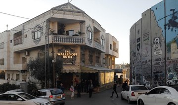 Grateful town of Bethlehem holds Banksy exhibition