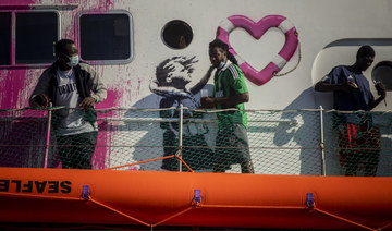 Italian coast guard in mission to save 200 migrants stranded on ‘Banksy’ rescue boat