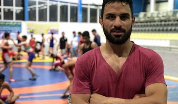 ‘National hero’ Iranian wrestling champion sentenced to death