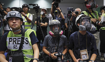 Hong Kong journalists protest new accreditation rules
