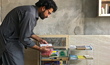 In Pakistani city where libraries are scarce, select barbershops offer trimming of literature