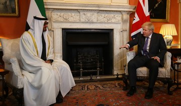 Britain's Prime Minister Boris Johnson (R) talks with greets Abu Dhabi's Crown Prince Sheikh Mohammed bin Zayed al-Nahyan inside 10 Downing Street in central London on December 10, 2020. (File/AFP)