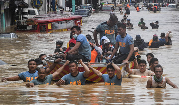 Rescuers pull a rubber boat carrying residents through a flooded street after Typhoon Vamco hit in Marikina City, suburban Manila on November 12, 2020. (AFP/File Photo)