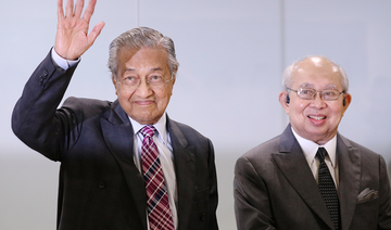 Malaysia PM holds on to power with budget win