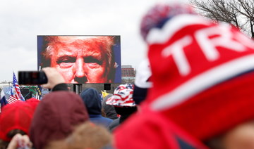US President Donald Trump is seen on a screen speaking to supporters during a rally to contest the certification of the 2020 US presidential election results by the US Congress, in Washington. (Reuters/File Photo)