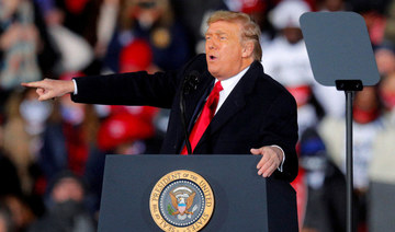 US President Donald Trump gestures while campaigning for Republican Senator Kelly Loeffler on the eve of the run-off election to decide both of Georgia's Senate seats, in Dalton, Georgia on January 4, 2021. (REUTERS/Brian Snyder/File Photo)