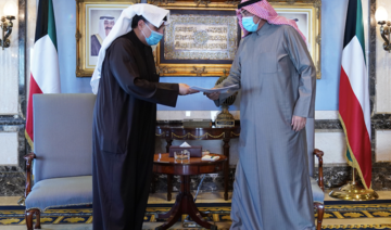 Kuwait’s Prime Minister Sheikh Sabah Al-Khalid Al-Sabah (R) received Defense Minister Sheikh Hamad Jaber Al-Sabah (L) and other government ministers at Seif Palace, where they handed their resignation. (KUNA)