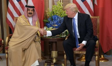Outgoing US President Donald Trump awarded the King of Bahrain the Legion of Merit with the Degree of Chief Commander. (File/AP)
