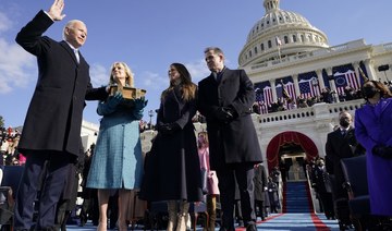 Joe Biden is sworn in as the 46th President of the United States as his spouse Jill Biden holds a bible on the West Front of the US Capitol in Washington DC, January 20, 2021. (AFP)