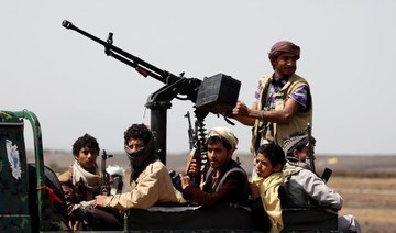 Houthi fighters ride on the back of a patrol truck as they secure the site of a pro-Houthi tribal gathering in a rural area near Sanaa, Yemen. (File/Reuters)