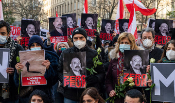 People gather to commemorate prominent Lebanese activist and intellectual Luqman Slim at place de la Sorbonne in the French capital Paris, on February 11, 2021. (AFP)